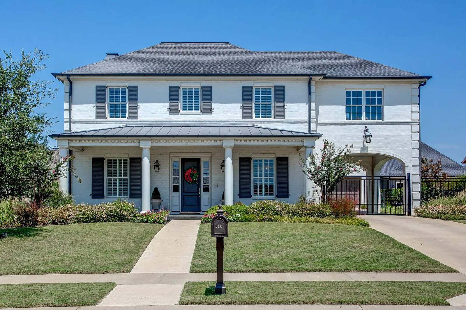 Fort Worth home framed by mature trees