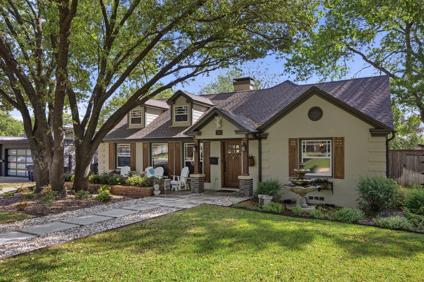 Home exterior on a tree-lined street in Monticello, Fort Worth